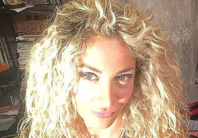 Новата на Берлускони си татуира инициалите му