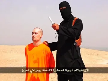 Британец обезглавил американския журналист в Сирия