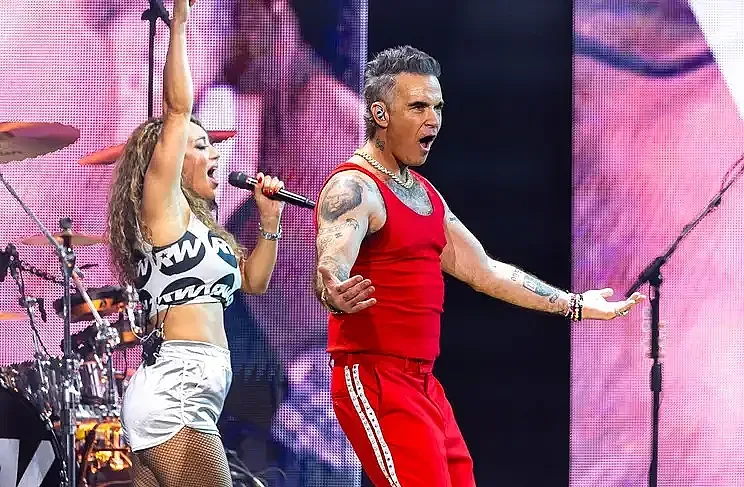 Министър взе решение за огромната излагация с Роби Уилямс